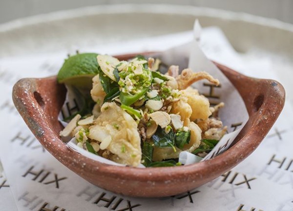 Crispy fried squid with garlic, curry leaves and almonds