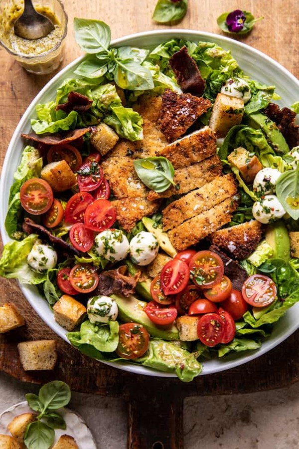 Crispy Italian chicken and bacon salad with pesto tahini dressing and sourdough croutons
