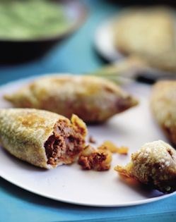 Crispy masa rolls filled with potatoes and chorizo (Molotes de masa con papas y chorizo)