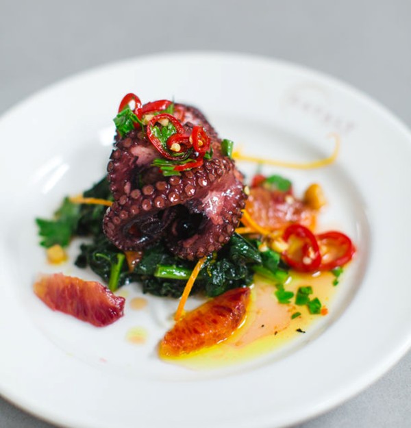 Crispy octopus with cavolo nero and hazelnuts
