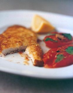 Crispy Parmesan chicken with soft basil tomatoes
