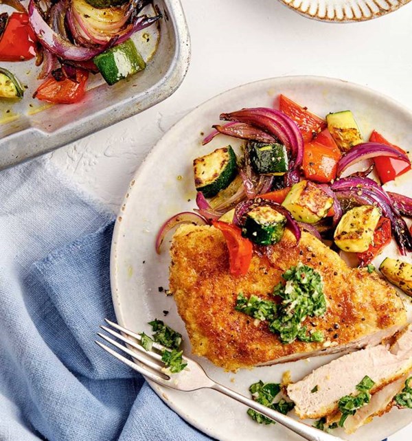 Crispy Parmesan pork steaks with roast summer vegetables