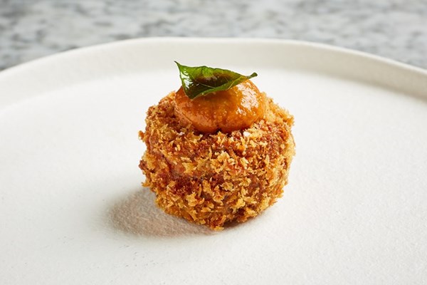 Crispy pig head and Goan sausage with spiced apple chutney