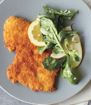 Crispy pork cutlets with arugula and apple salad