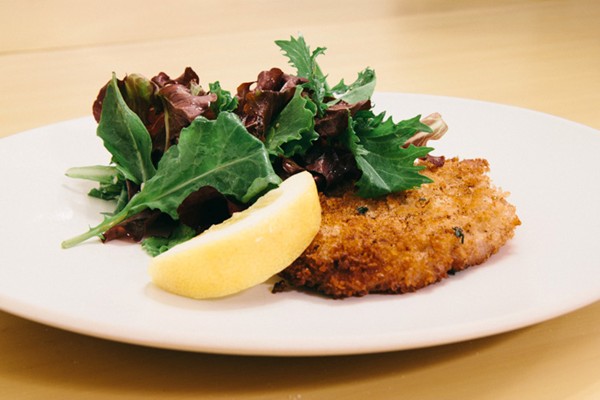 Crispy pork schnitzel with mixed greens