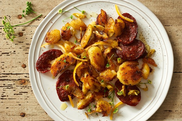 Crispy potato-chorizo hash with preserved lemon and parsley flowers