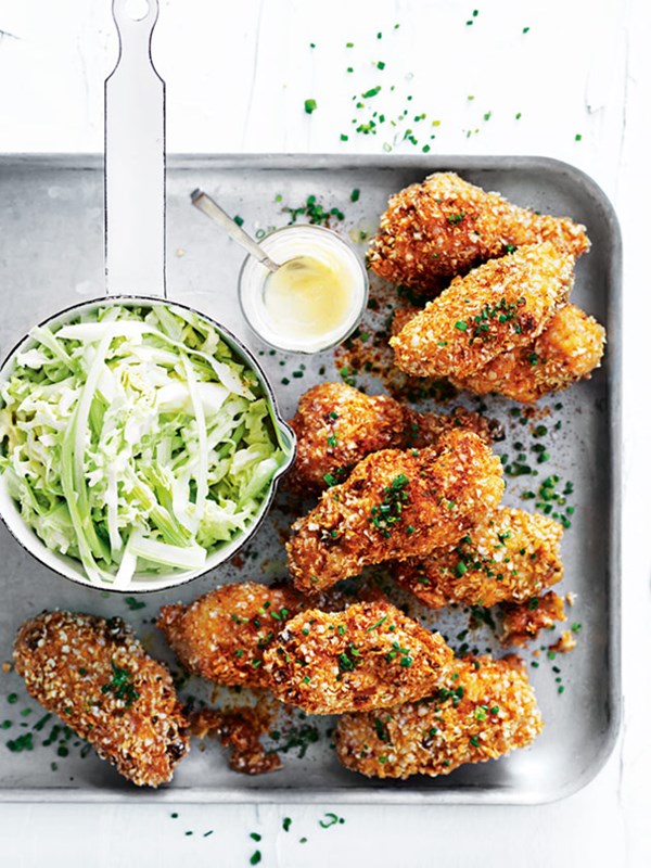 Crispy quinoa chicken wings with celery and cabbage slaw