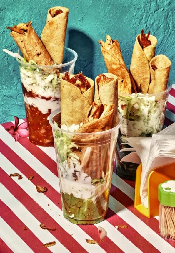 Crispy rolled tortillas filled and drowned or dipped in salsa (Flautas or taquitos ahogadas)