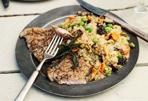 Crispy sage pork cutlets with couscous, peas, figs, and pistachios