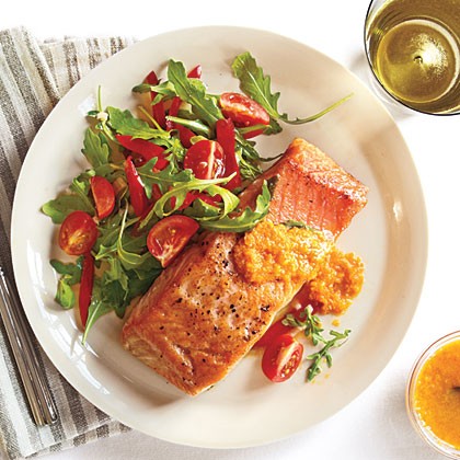 Crispy salmon and arugula salad with carrot-ginger vinaigrette