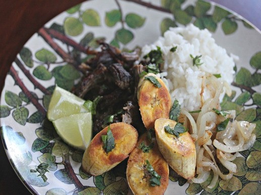 Crispy, shredded Cuban beef with pan-fried onions and plantains