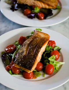 Crispy-skin salmon salad with roasted cherry tomatoes