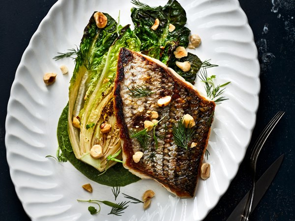 Crispy-skinned bass with braised lettuce and green goddess dressing