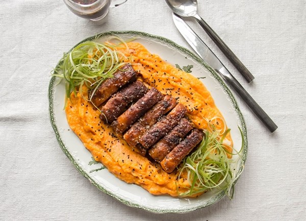 Crispy slow-cooked pork belly with pumpkin mash and black sesame 