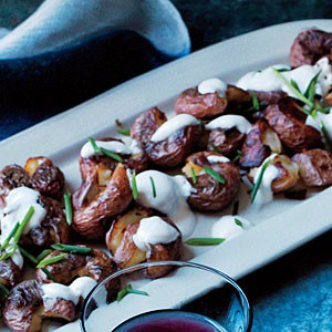 Crispy smashed potatoes with chive sour cream