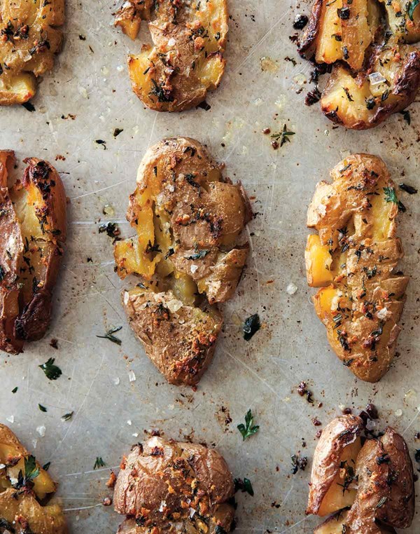 Crispy smashed potatoes with herbs