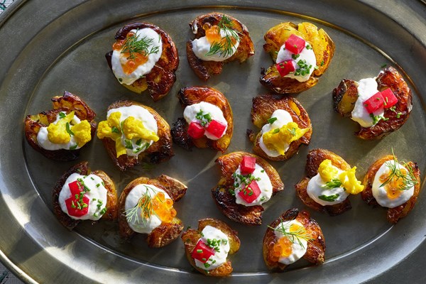 Crispy smashed potatoes with pickles and gin-spiked sour cream