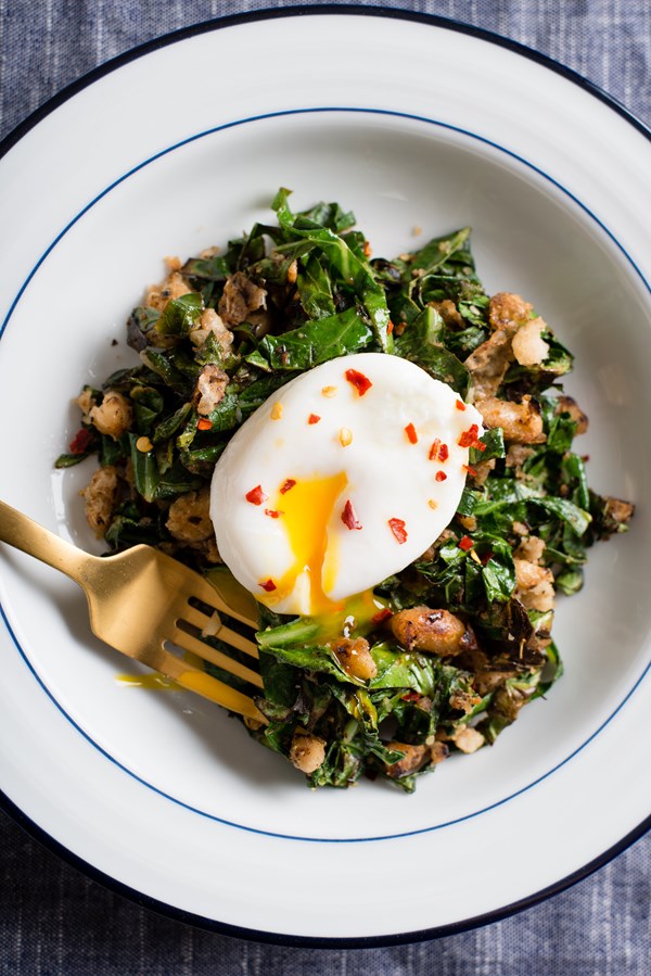 Crispy white beans with greens and poached egg
