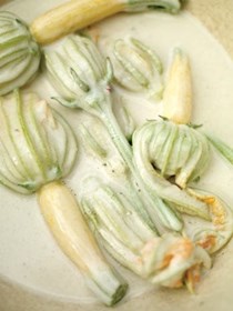 Crispy zucchini flowers stuffed with ricotta and mint