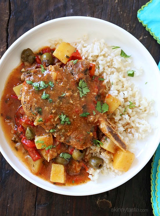 Crock pot sazon pork chops with peppers, olives and potato