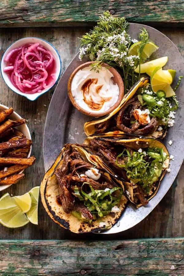 Crockpot carne asada tacos with cilantro lime garlic sauce