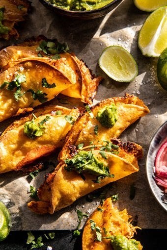 Crockpot crispy chicken tinga tacos with jalapeño avocado crema
