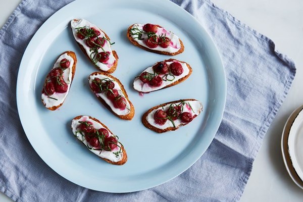 Crostini with roasted grapes, vanilla yogurt, and fresh basil