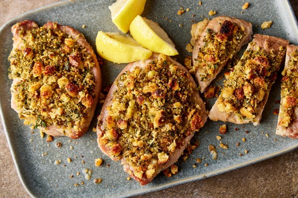 Crumb-crusted pork chops with green olives and capers