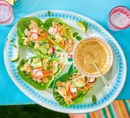 Crunchy lettuce salad wraps with sweet satay dip