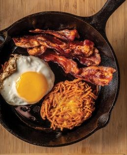 Crunchy potato latkes with bacon and eggs