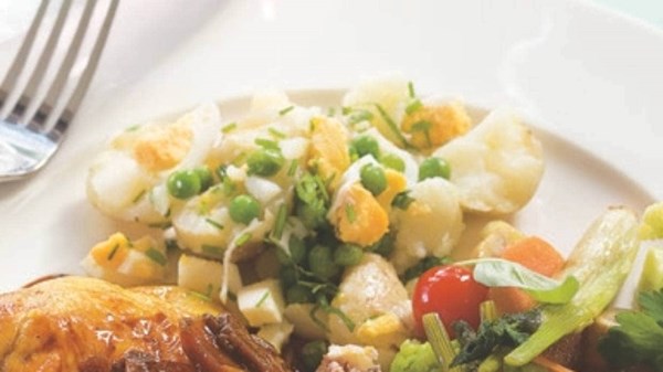 Crushed new potatoes with peas, hard-boiled eggs, olive oil and herbs