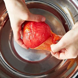Crushing tomatoes by hand