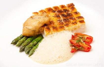 Crusted Alaska halibut with asparagus, confit tomatoes and oyster beignet