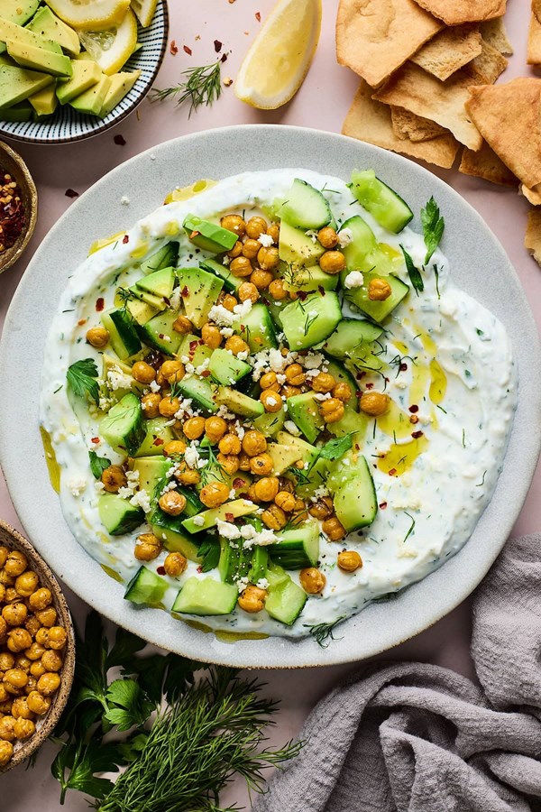 Cucumber, avocado, & crispy chickpea salad with creamy yogurt feta spread