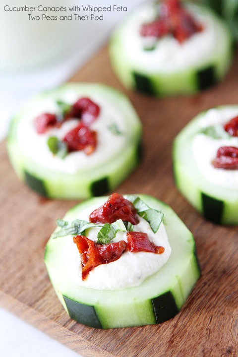 Cucumber canapés with whipped feta, sun-dried tomatoes, and basil