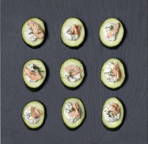 Cucumber wheels with salmon, tartare sauce and dill
