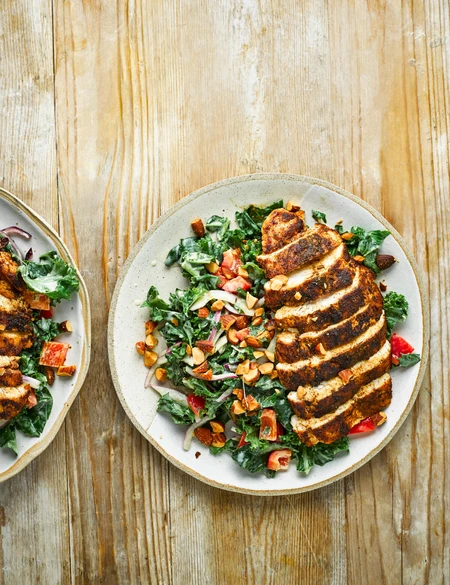 Cumin-crusted chicken with kale salad and hummus dressing