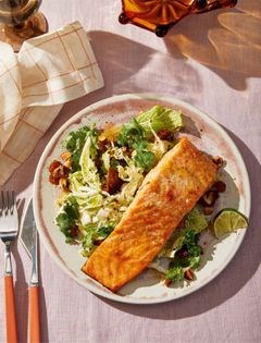 Cumin, ginger, and citrus roasted salmon with cabbage, dates, and creamy tahini dressing