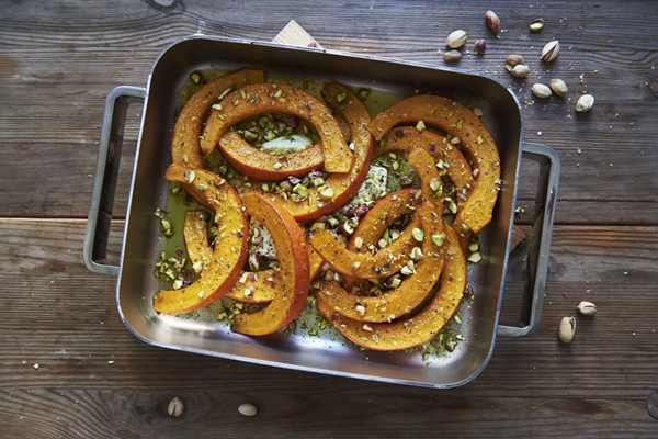 Cumin-roasted squash wedges with pistachio-feta dip