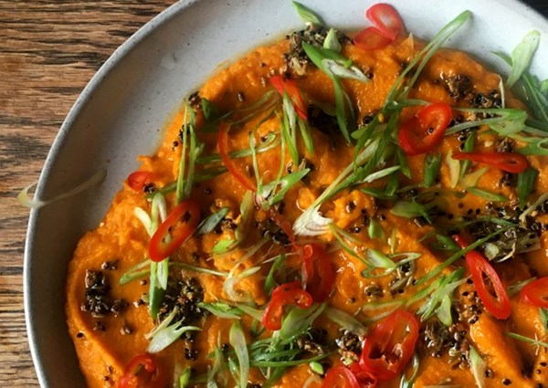 Curried carrot mash with brown butter and quick-pickled chillies