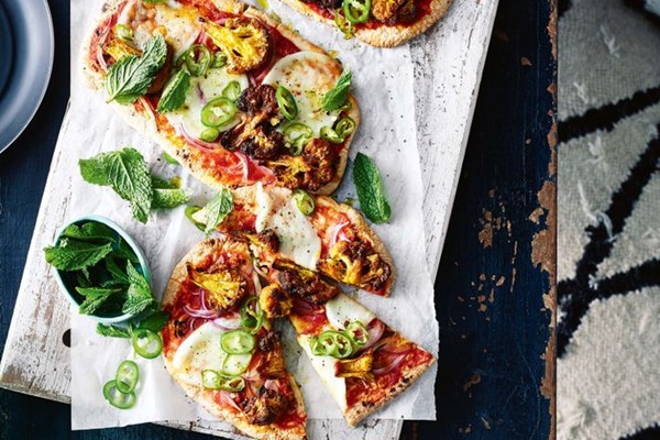 Curried cauliflower and green chilli naan pizzas