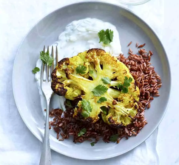 Curried cauliflower steaks & red rice with tzatziki