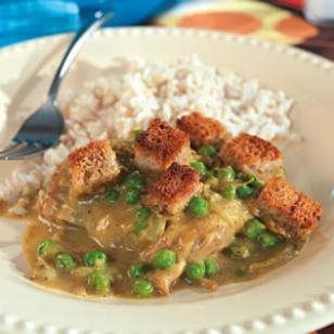 Curried chicken thighs with buttery croutons