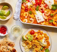 Curried corn with cod & prawns