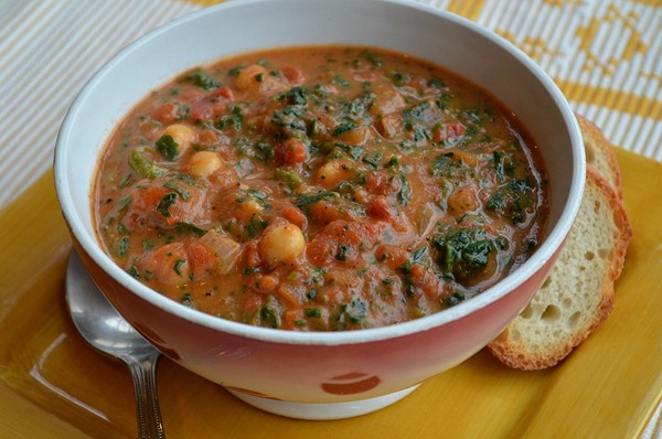 Curried cream of tomato soup with chickpeas and spinach