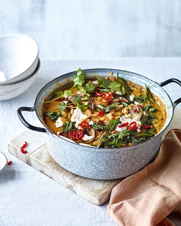 Curried lentil soup with kale and almond topper