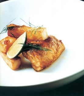 Curried monkfish and celeriac chips with lime wedges