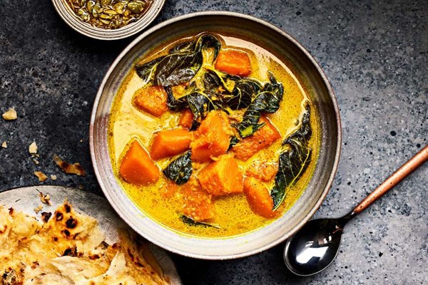 Curried pumpkin and buss up shut (Paratha roti)
