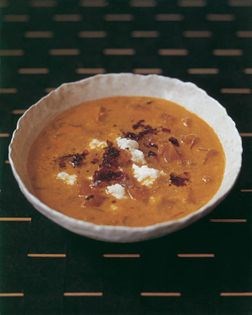 Curried pumpkin and swede soup with feta and caramelized red onion