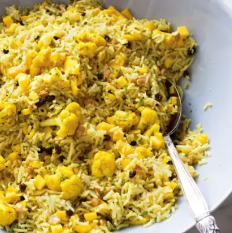 Curried rice salad with cauliflower, cashews, and mango